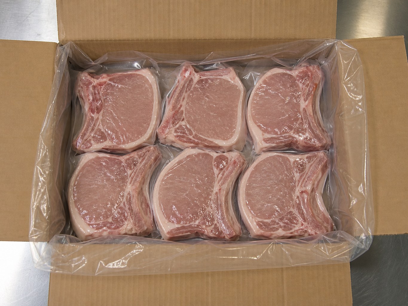 Six individually vacuum-sealed bone-in chops in a lined case