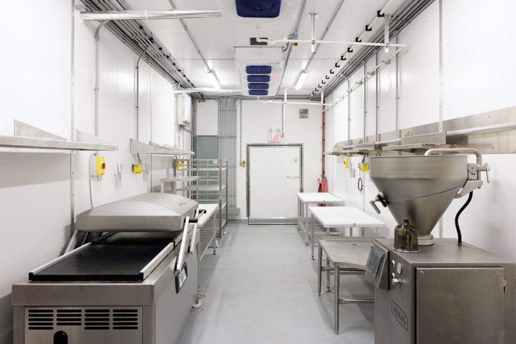 Bright stainless production room inside a USDA facility